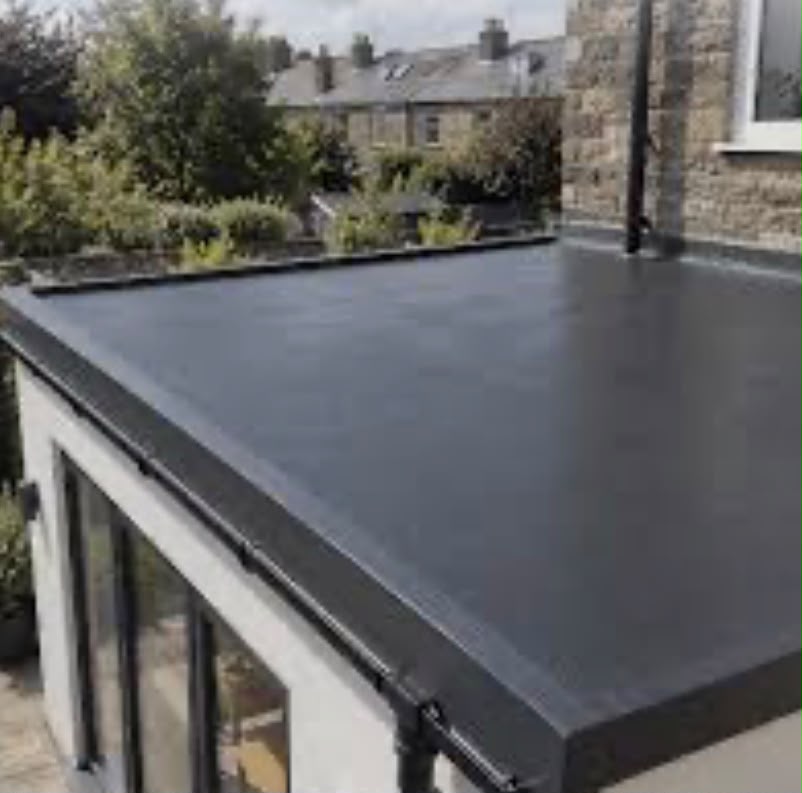 Completed dark liquid rubber roof on an extension